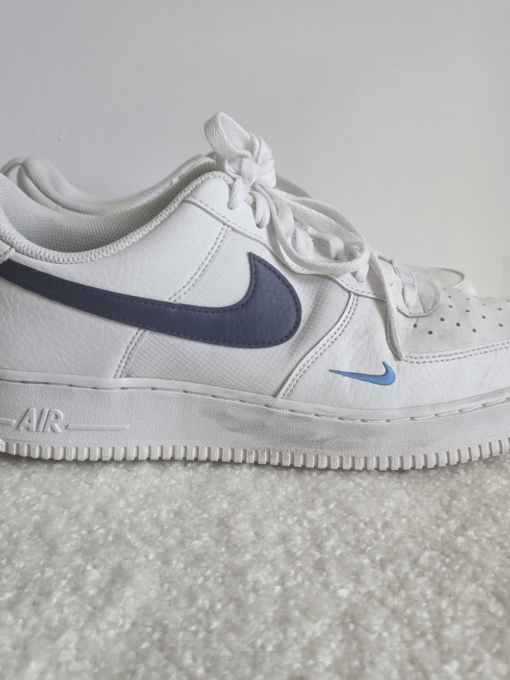 Nike Air Force 1 White Sneakers with Blue Swooshes